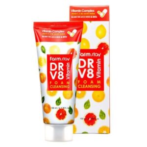 A tube of farmstay dr-v8 vitamin foam cleansing cream next to its bright packaging adorned with vibrant citrus fruits, highlighting its vitamin complex formulation for skincare.