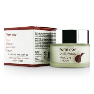 A jar of farm stay snail mucus moisture cream next to its packaging box, highlighting a skin care product made with snail extract.