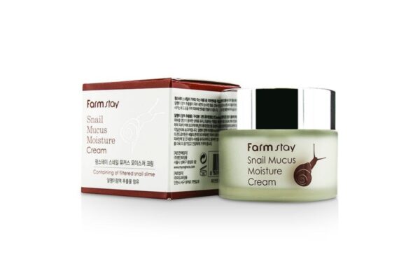 A jar of farm stay snail mucus moisture cream next to its packaging box, highlighting a skin care product made with snail extract.